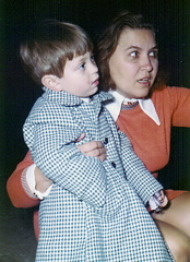 Brad in long coat, with Montisori teacher Kathy