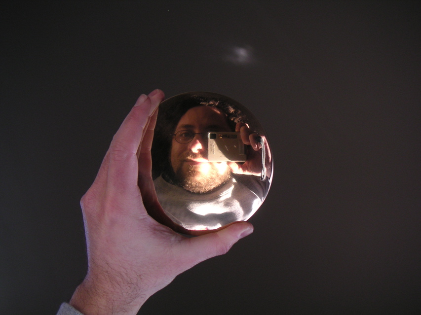 Seen directly on it's a normal (if slightly convex) mirror